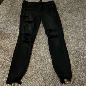 Black American eagle jeans with patched holes